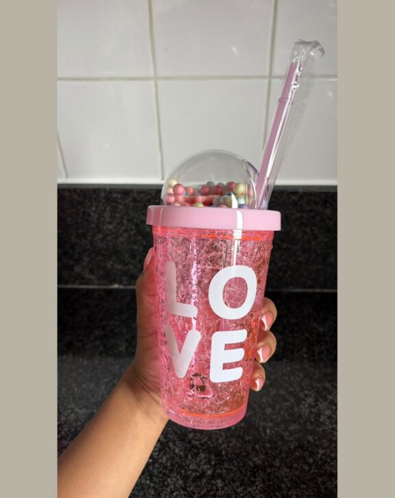 Double-wall freezer tumbler with dome lid and straw.